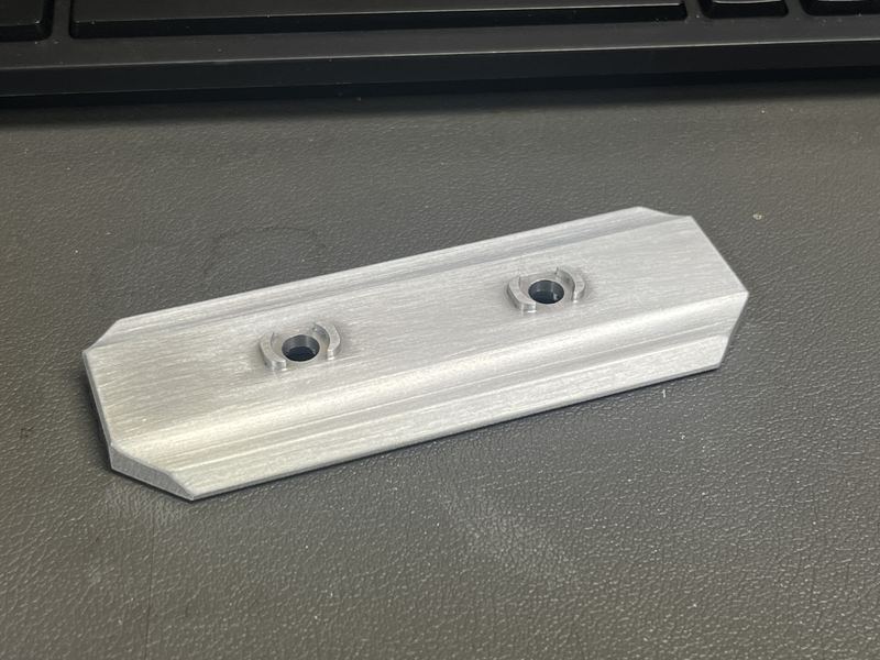 Chamfered aluminum rail with two counterbored mounting holes