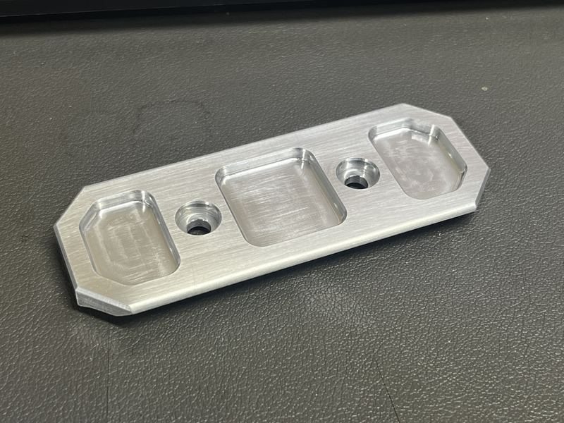 Aluminum plate with three radiused pockets